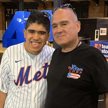 Dom and Michael wearing a Mets shirt