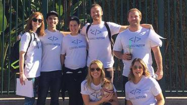 Group of people wearing Coding Autism shirts