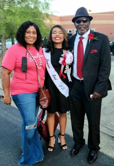 Jada with her family after winning an award