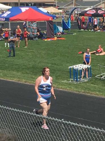 Jennie running during a track event