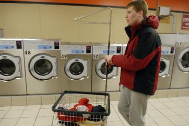 Karl learns to do his own laundry in the community