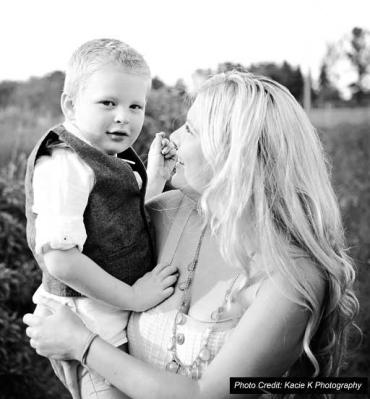 Kate Swenson holding her son