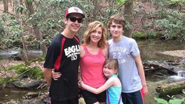 Kathy Hooven and her children on a hike