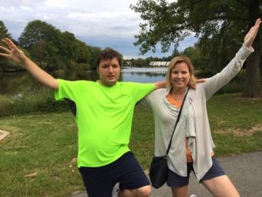 Lisa and her son John with their arms in the air