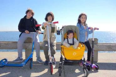 Lulu Mann and her family riding scooters