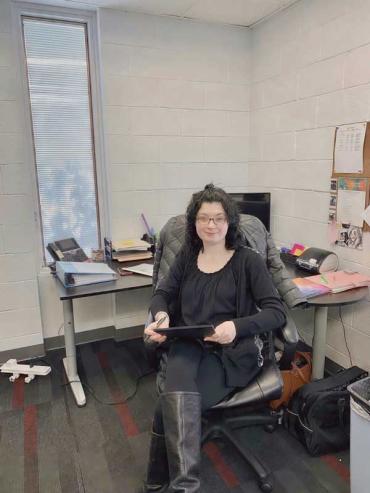 Mary Fay sitting at a desk