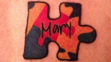 Michael Anaclerio's puzzle piece tattoo in honor of his sister, Mary