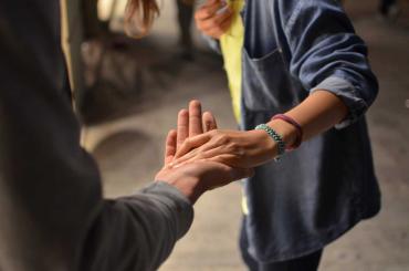 People holding hands to show support