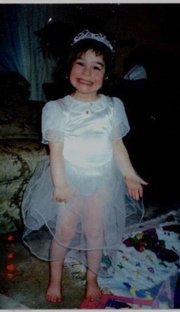 Sophie as a toddler wearing a princess costume