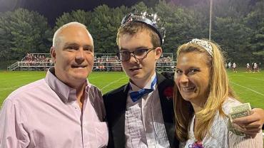 Warren and his parents after he was crowned Homecoming King