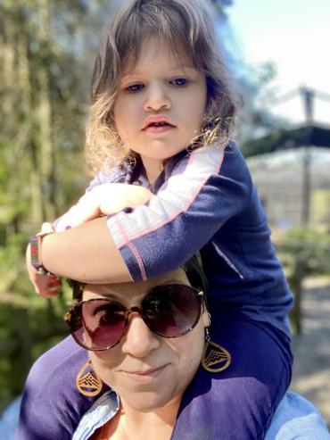 Wilder sitting on his moms shoulders