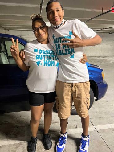 a mother and son wearing shirts that support autism