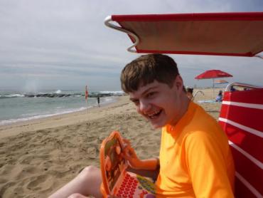 an autistic boy at the beach