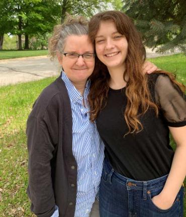 autistic mom smiling with her daughter