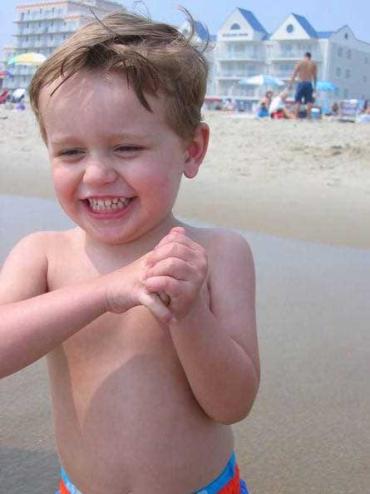 blonde toddler on the beach