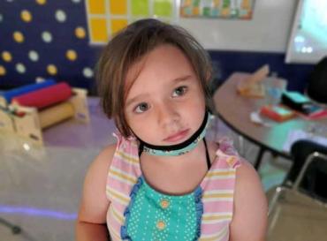 little girl in an at-home therapy room