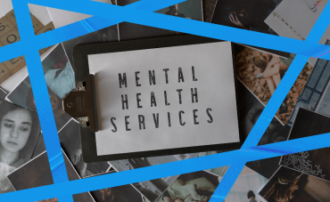 clipboard holding white paper with "MENTAL HEALTH SERVICES" written on it, laying on top of photos of people; five strips of blue tape surrounding sign