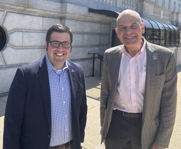 David Sitcovsky and Stuart Spielman, both men wearing suits and standing next to each other outside