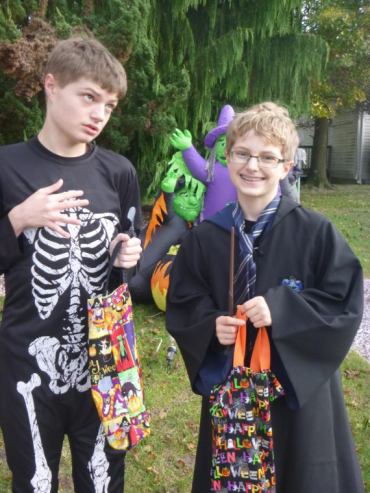 two young boys in Halloween costumes