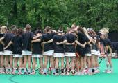 girls field hockey team in a huddle