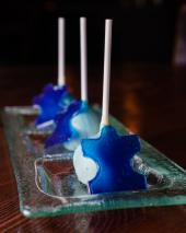 Blue cakepops with the autism puzzle piece created by TAO Group for World Autism Month
