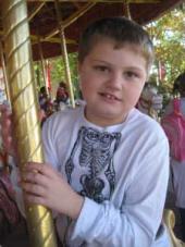 young boy on a carousel